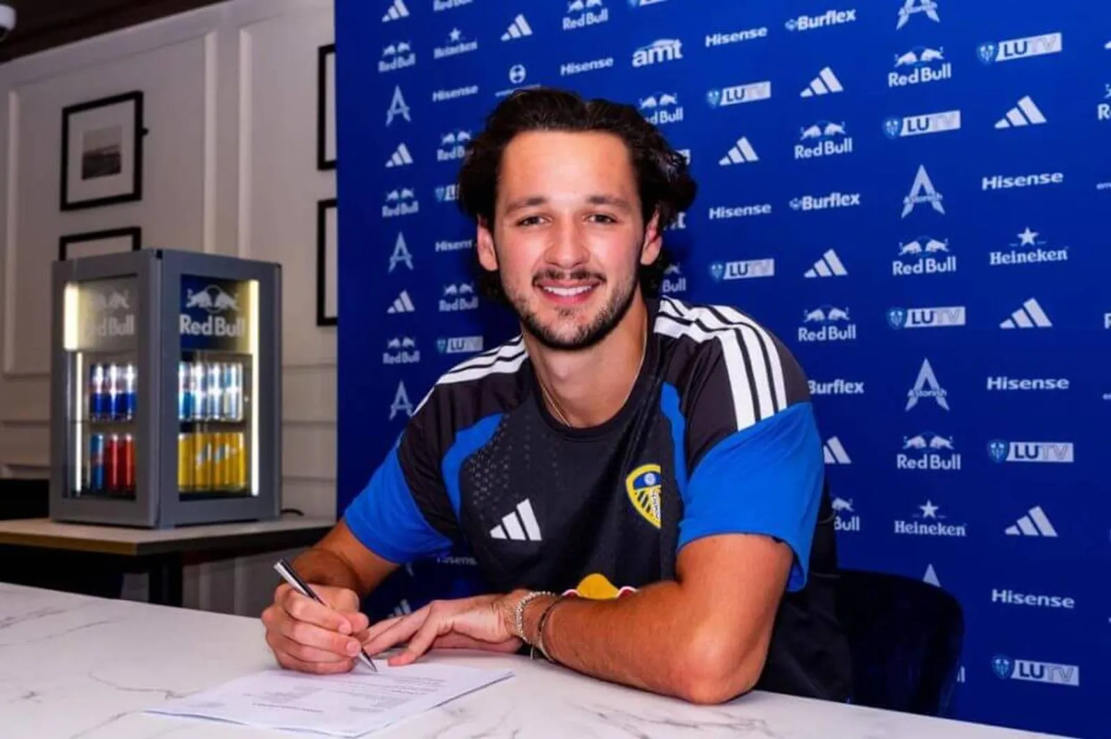 Trafford signing his Leeds United contract