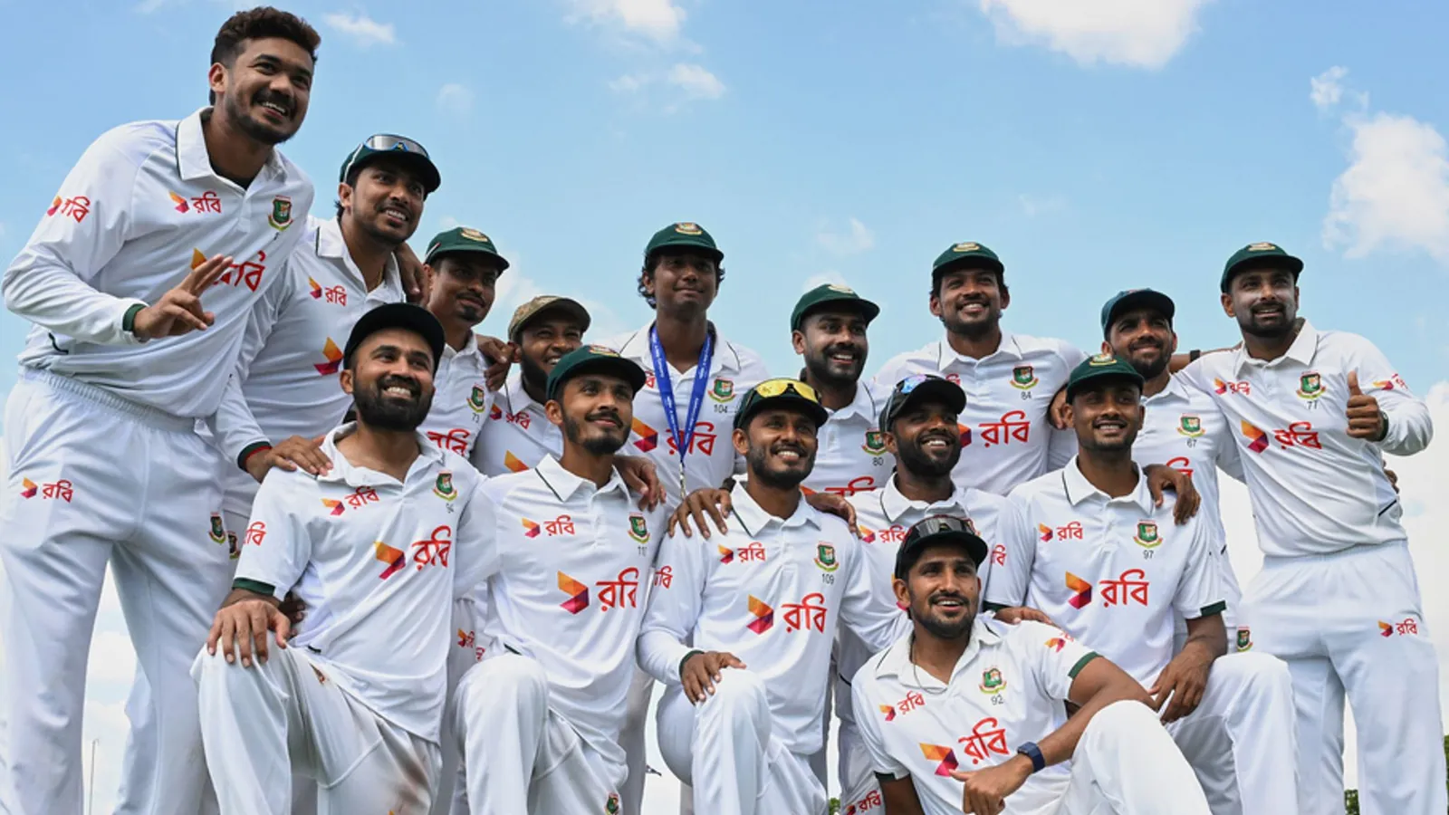 Bangladesh players pose for a team photo as they celebrate their historic victory over Australia